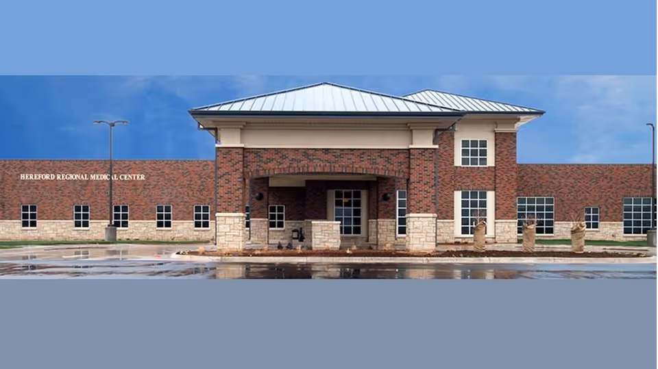 Brick Hereford Regional Medical Center exterior with a covered entrance and windows.