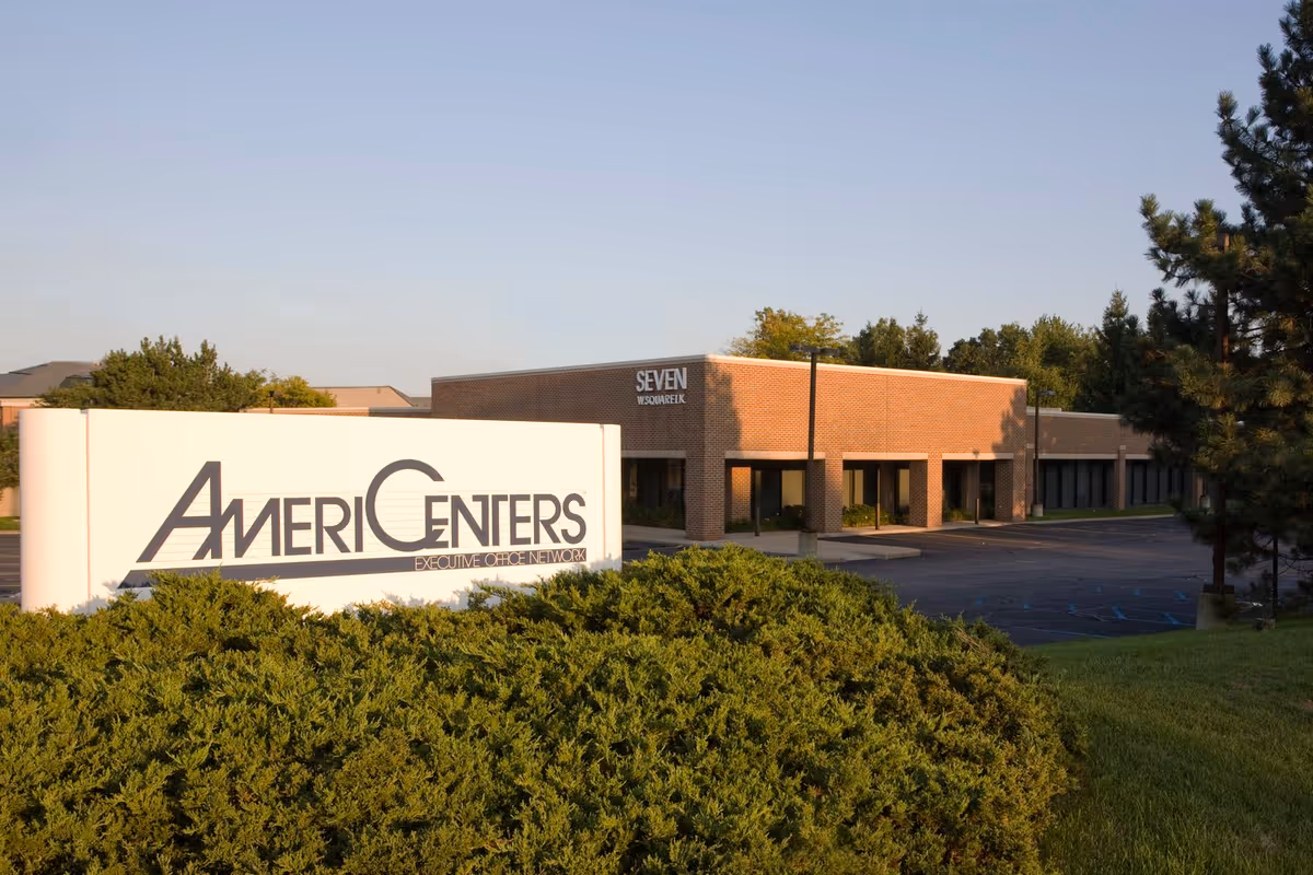 Exterior view of a brick facility with a large AmeriCenters sign in front