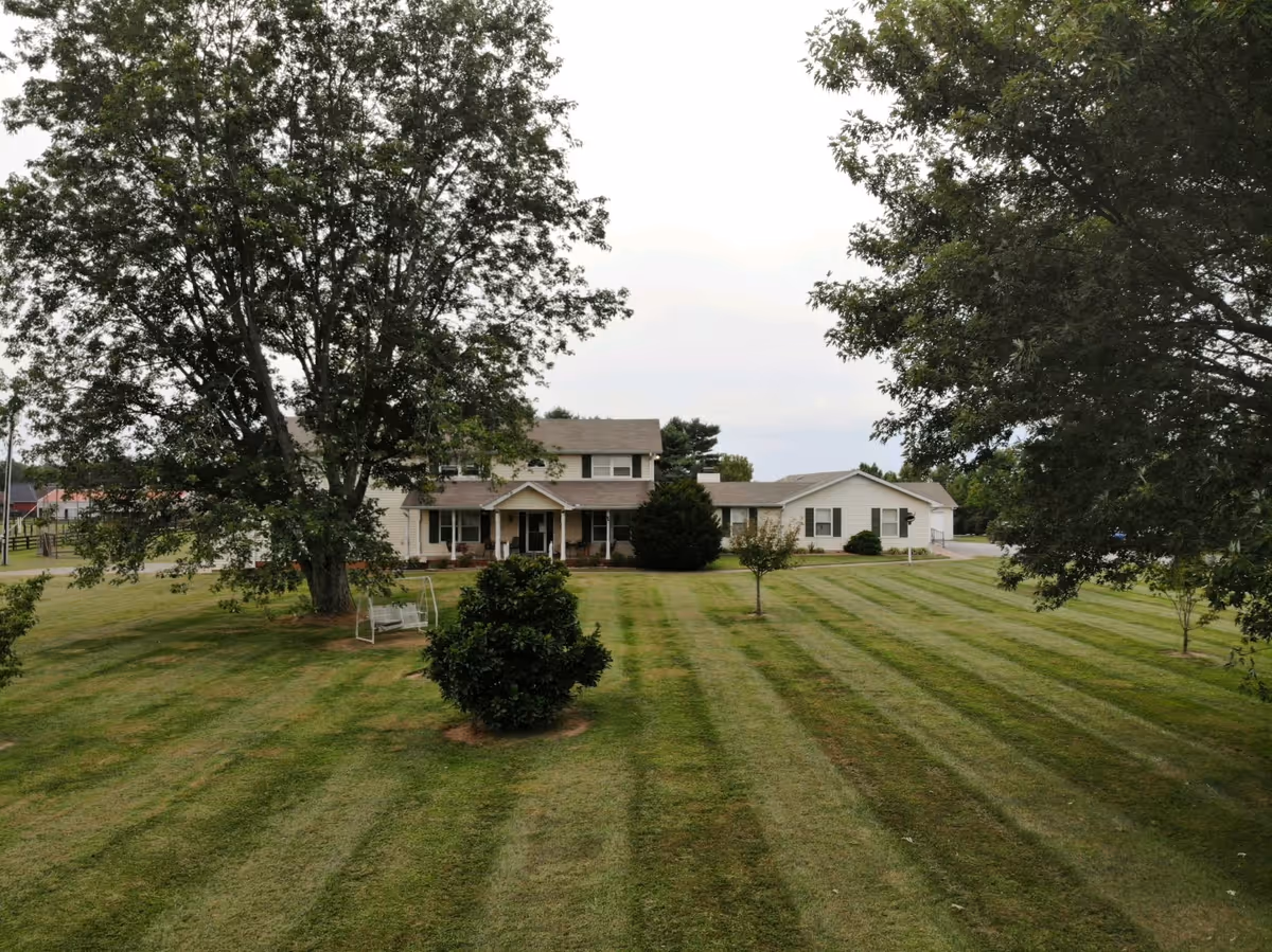 Front exterior of The Waterford in Sango, featuring a well-kept lawn and building facade.