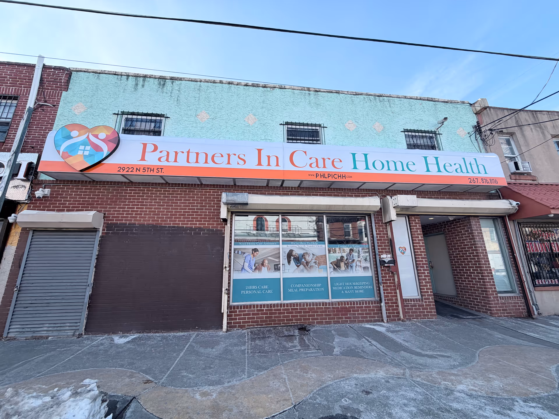 Exterior view of a brick building with a large Partners In Care Home Health sign.