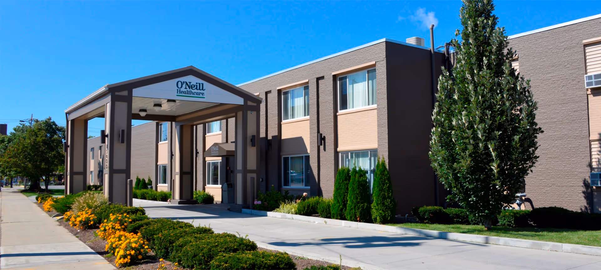 Exterior view of O'Neill Healthcare Lakewood entrance with a covered front porch.