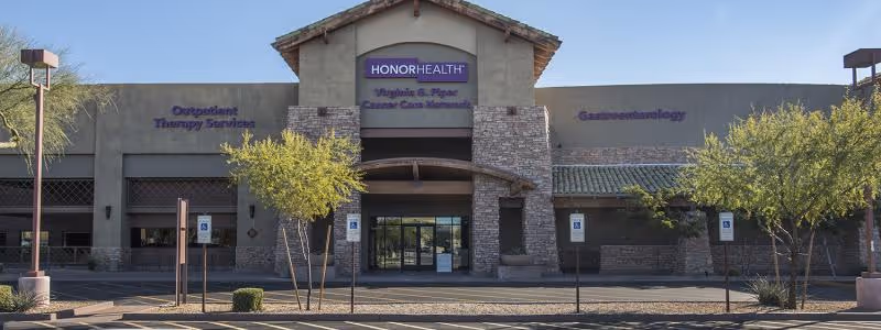 Exterior view of HonorHealth Outpatient Therapy Thompson Peak building with entrance and signage.