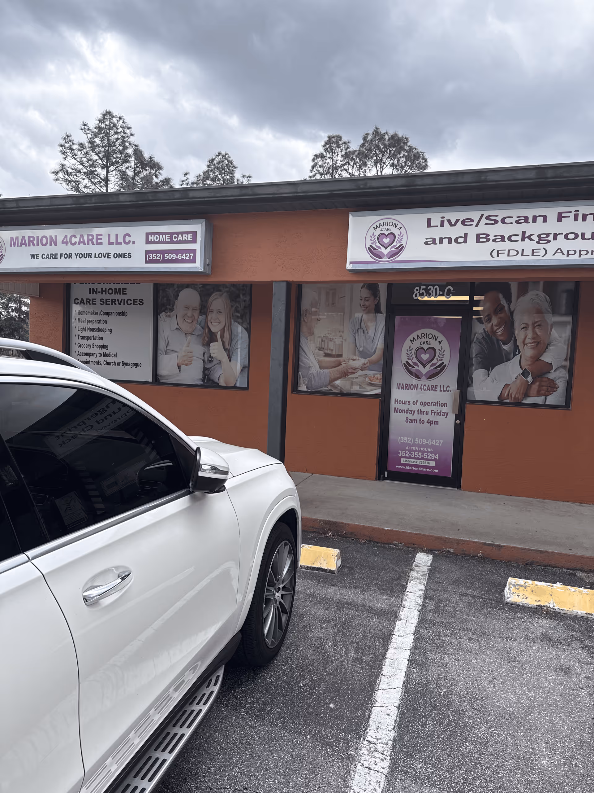 Orange storefront of Marion 4Care with signage and a white SUV parked in front.