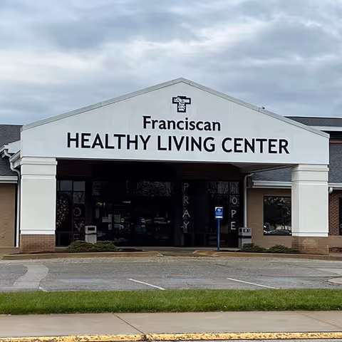 Front view of Franciscan Healthy Living Center with sign and glass entrance.