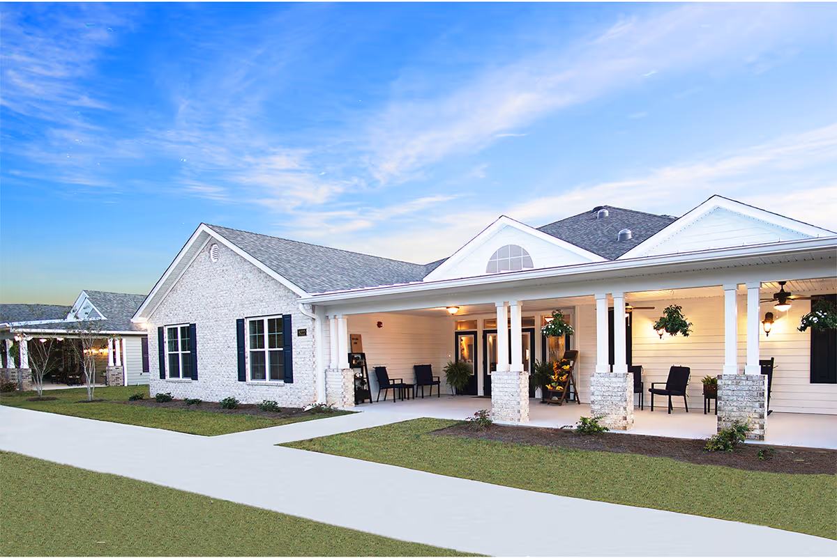 Exterior view of Villas at Killearn Lakes, a villa-style senior living facility with a covered porch.