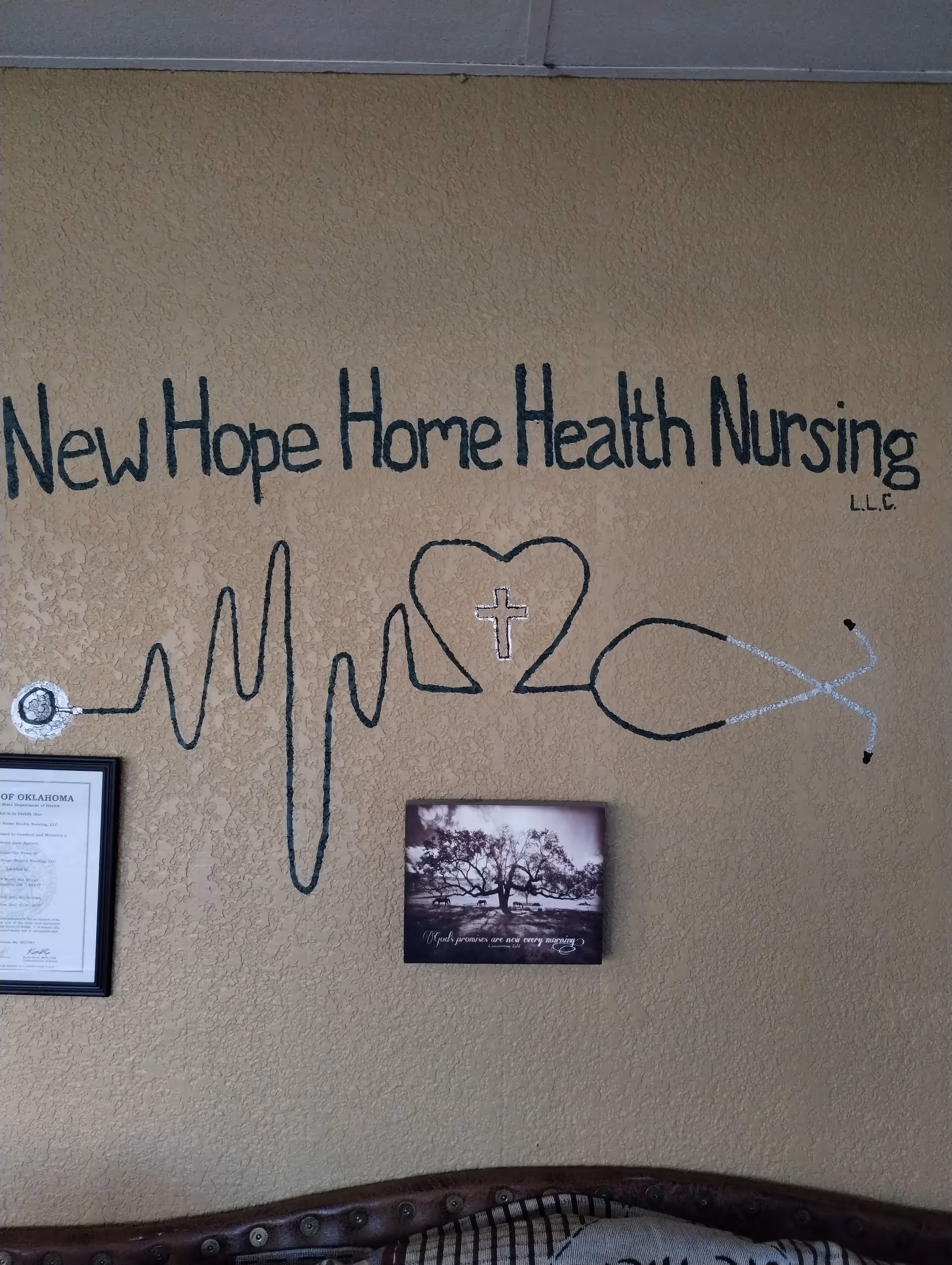Interior wall mural reads 'New Hope Home Health Nursing' with heart and stethoscope artwork.
