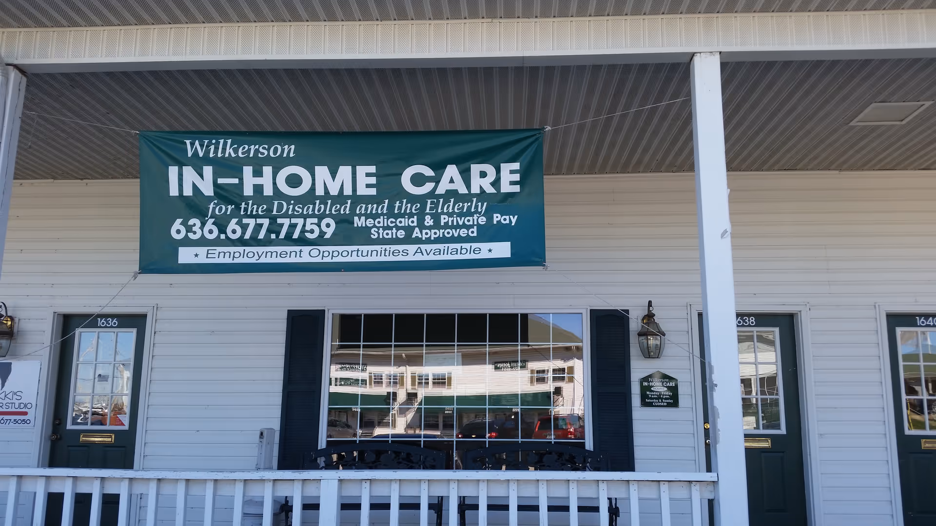 Exterior view of Wilkerson Health Care building with large banner and front doors