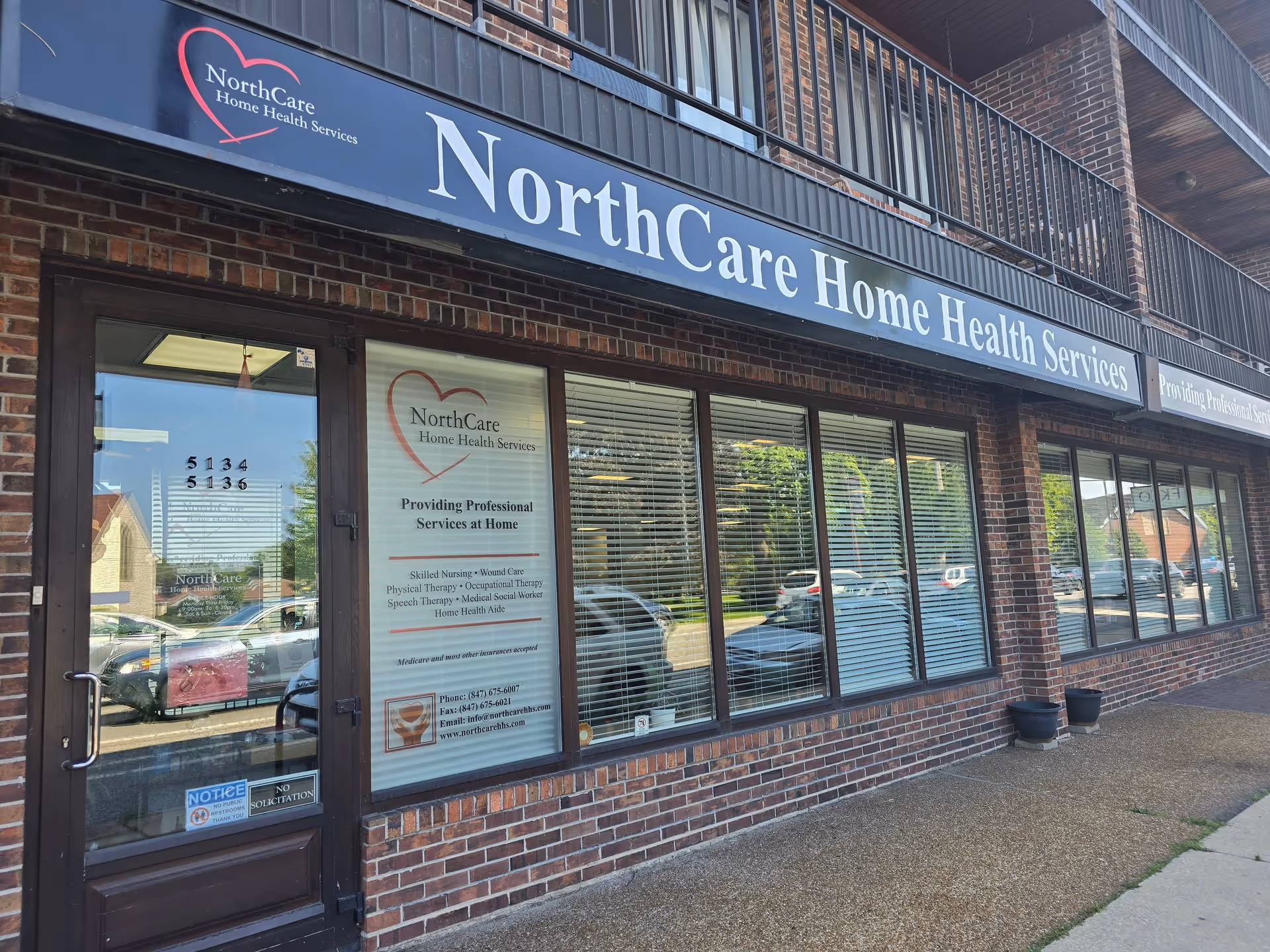 Front view of NorthCare Home Health Services storefront with brick exterior and large sign.