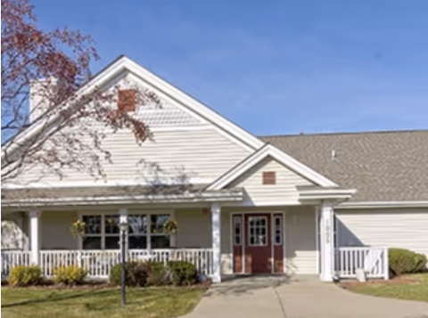 Exterior view of Northern Oaks Place showing a front entrance with a covered porch.