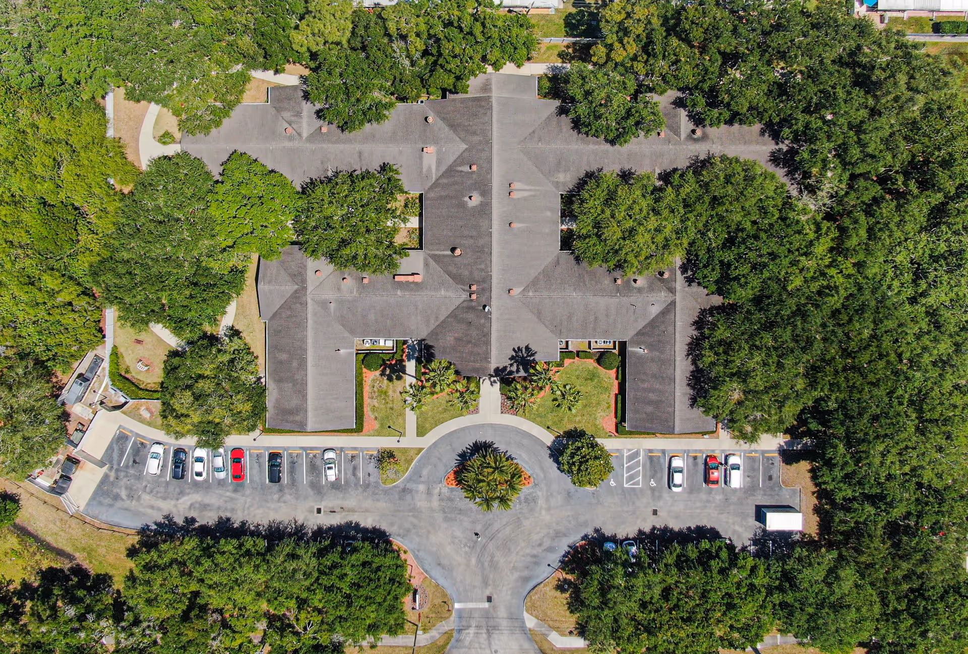 Aerial view of Arden Courts Largo with a central circular driveway, parking, and trees