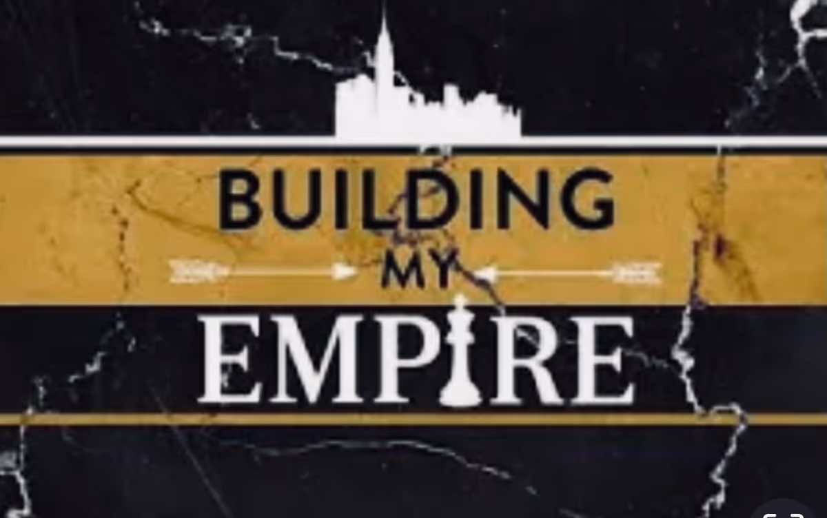 Cracked black-and-gold sign displaying Building My Empire.