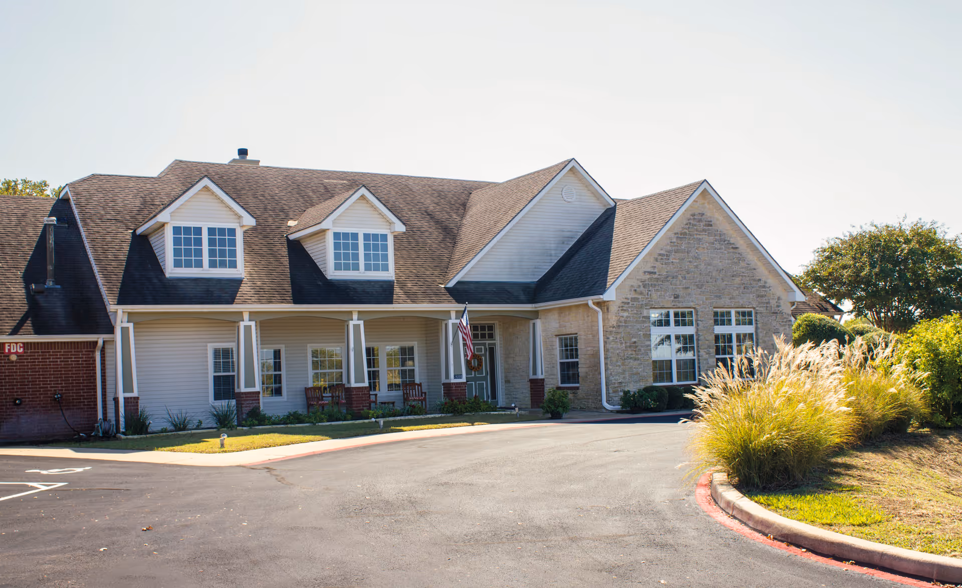 Brookdale Georgetown senior living facility front exterior with porch and landscaped surroundings.