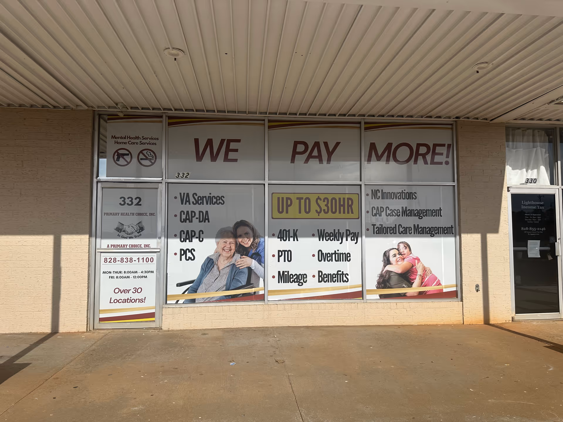 Storefront window signs advertise services with 'WE PAY MORE!' for Primary Health Choice.