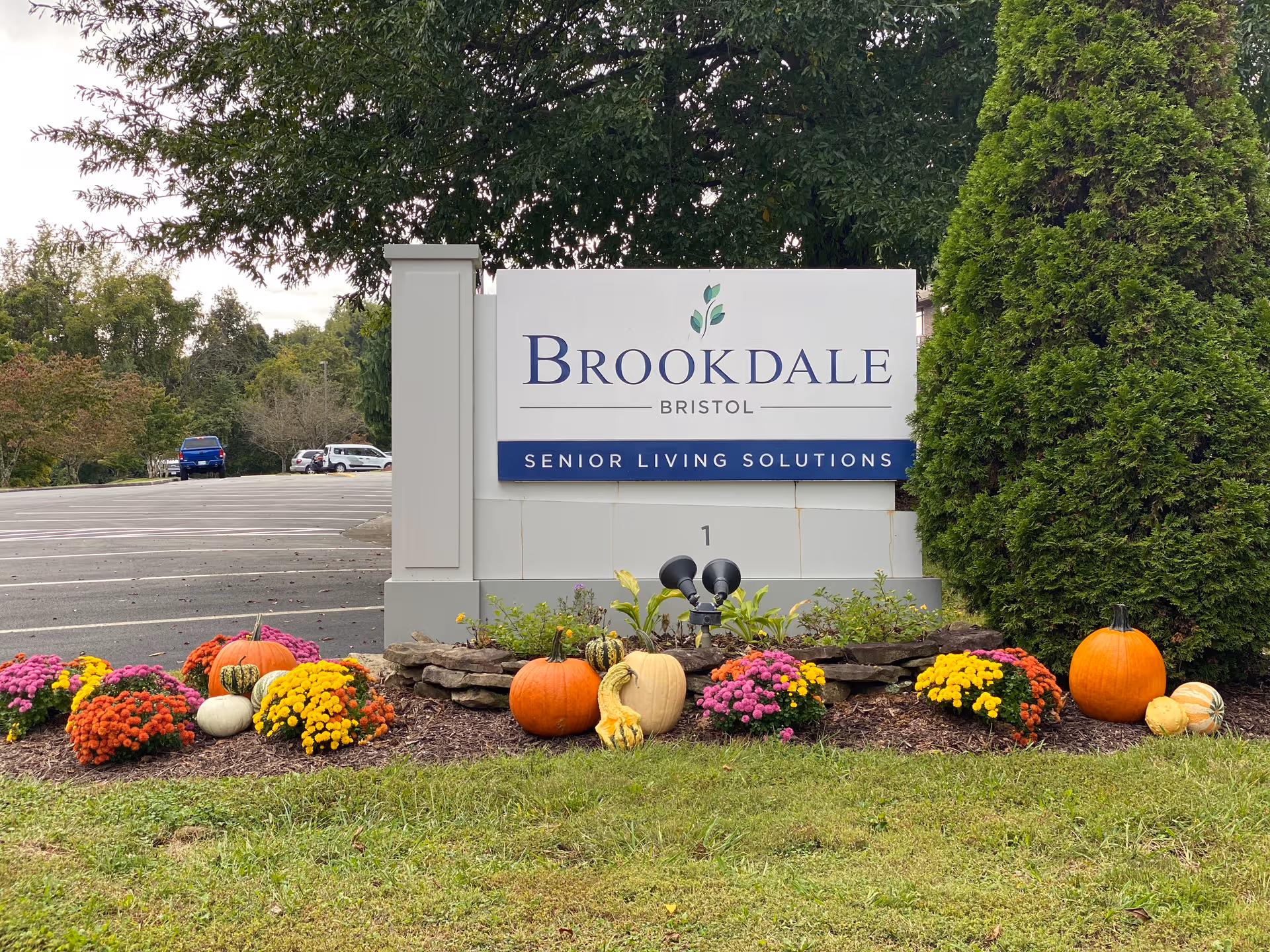 Brookdale Bristol outdoor sign with pumpkins and fall flowers in front