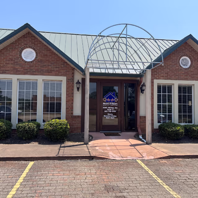 Exterior view of a building entrance for Heart 2 Heart Comfort Homecare LLC with glass door.