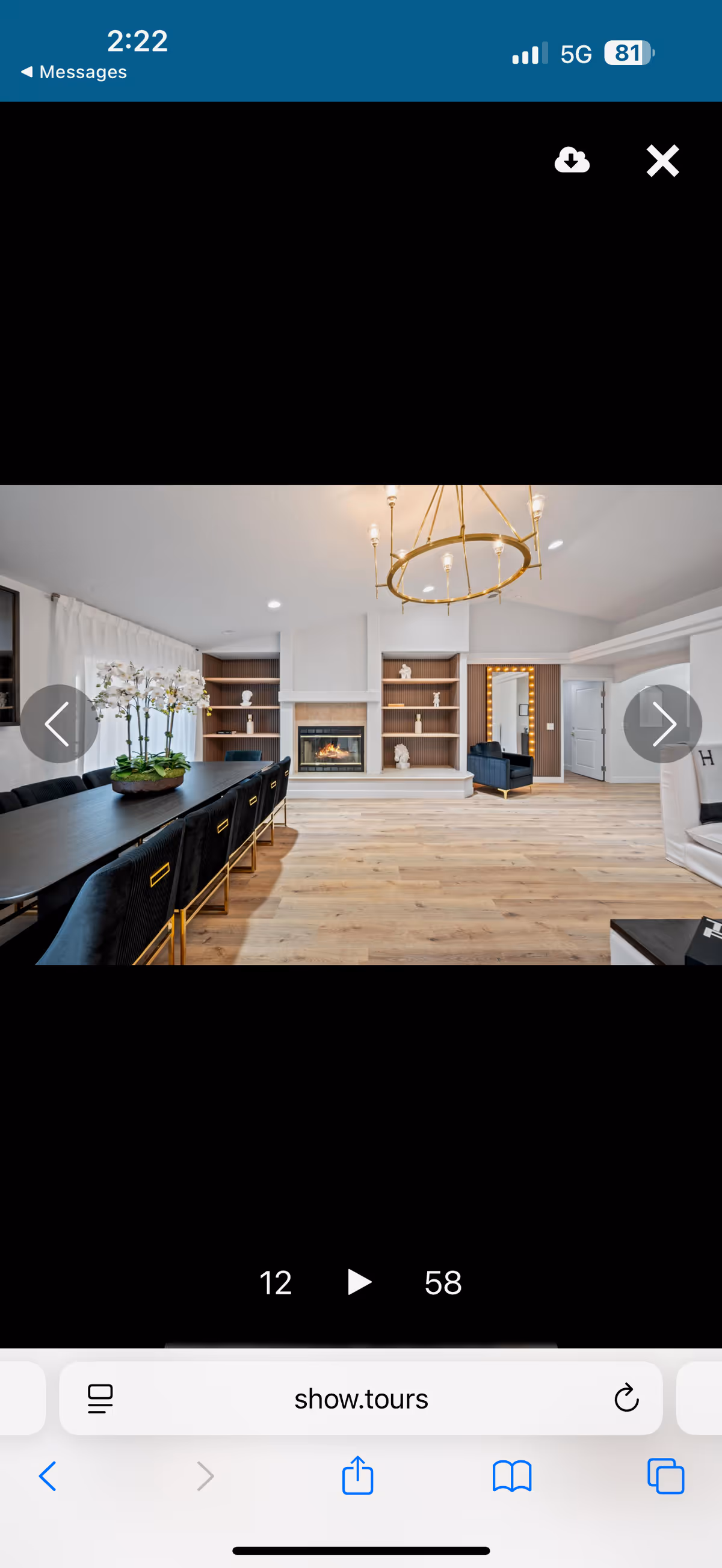 Spacious dining area with a long table, fireplace, and built-in shelves.