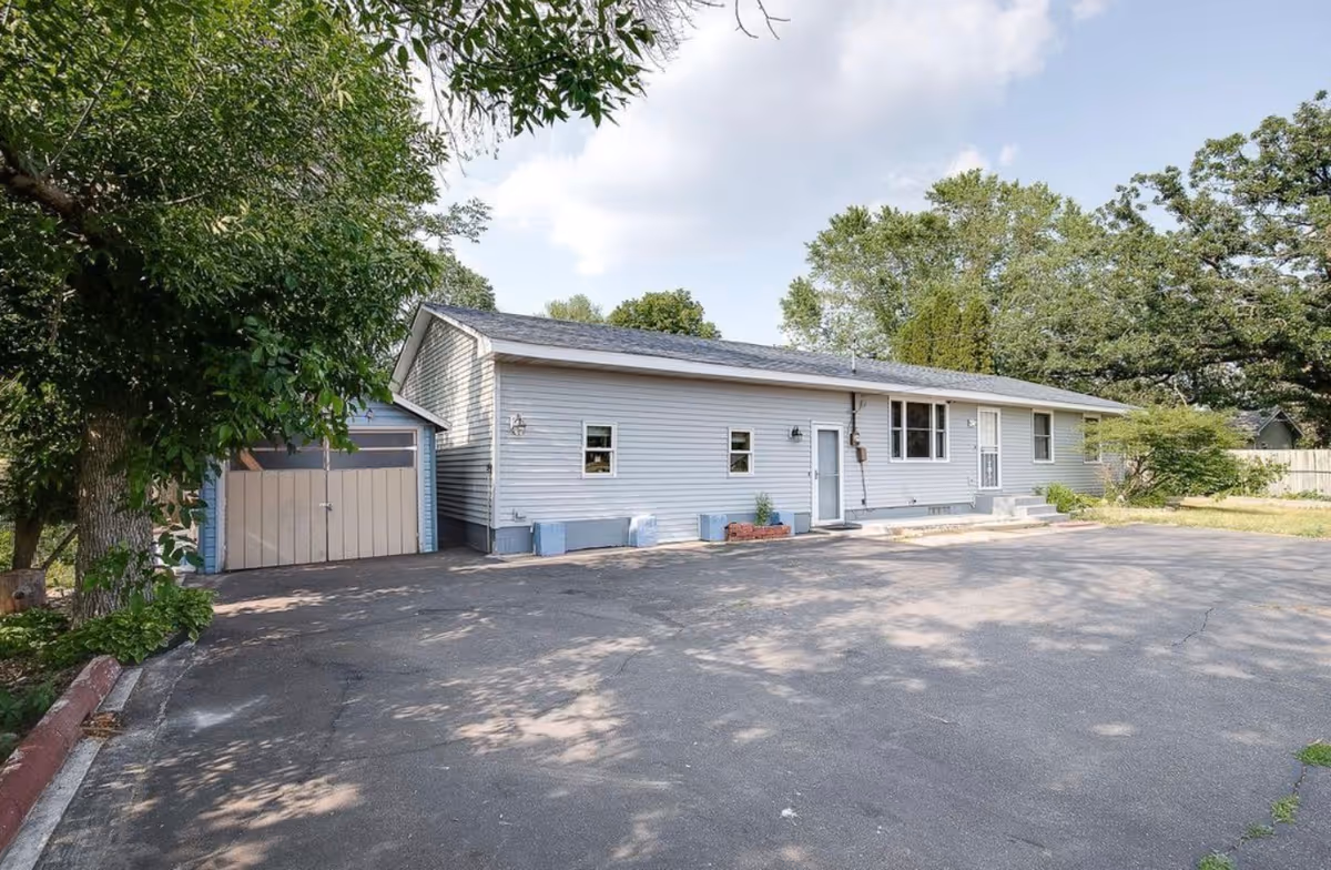 Bright Hope Care exterior: single-story gray facility with driveway and front entrance.