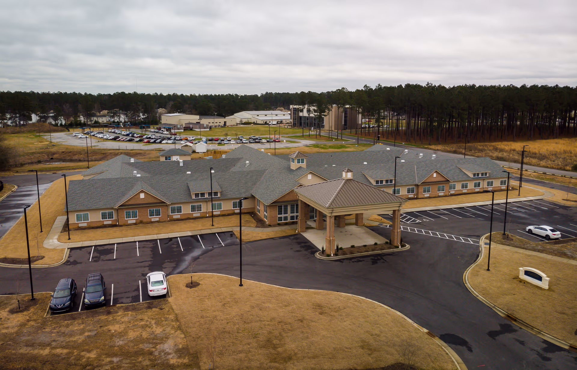 Aerial view of The Landings of Smithfield, a senior living facility with a front entrance.