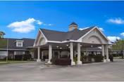 Front exterior view of Traditions of La Crescent, a senior living facility, with covered entrance.