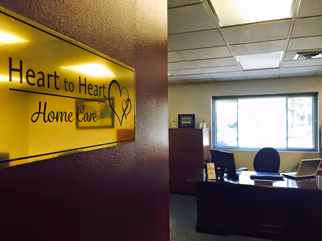 Interior office with Heart to Heart Home Care sign on a wall.