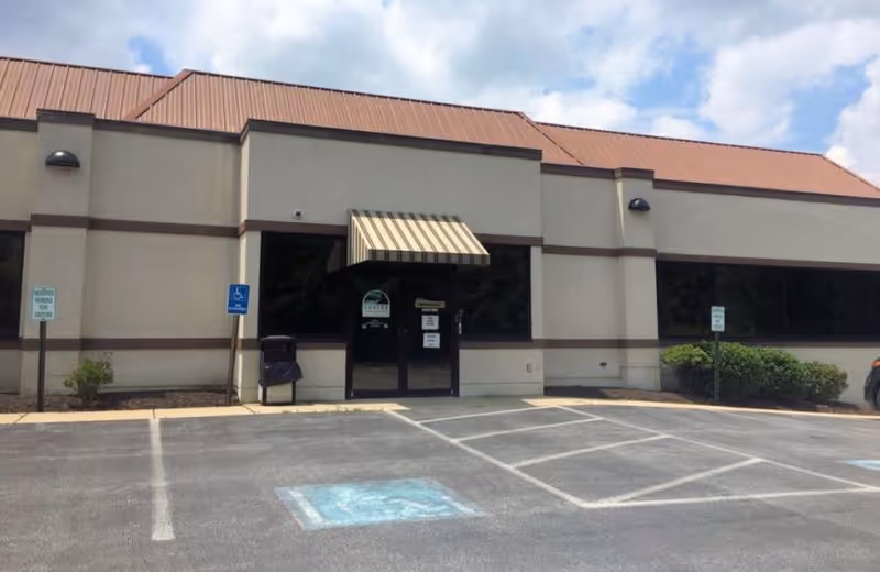 Exterior view of Care & Help Home Care Agency building with handicap parking.