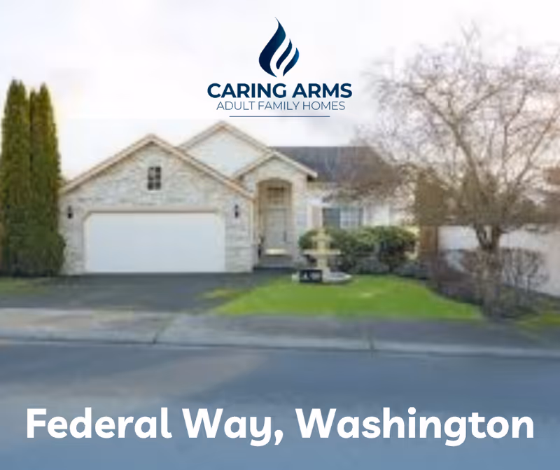 Front view of Caring Arms Adult Family Home with logo and Federal Way, Washington.