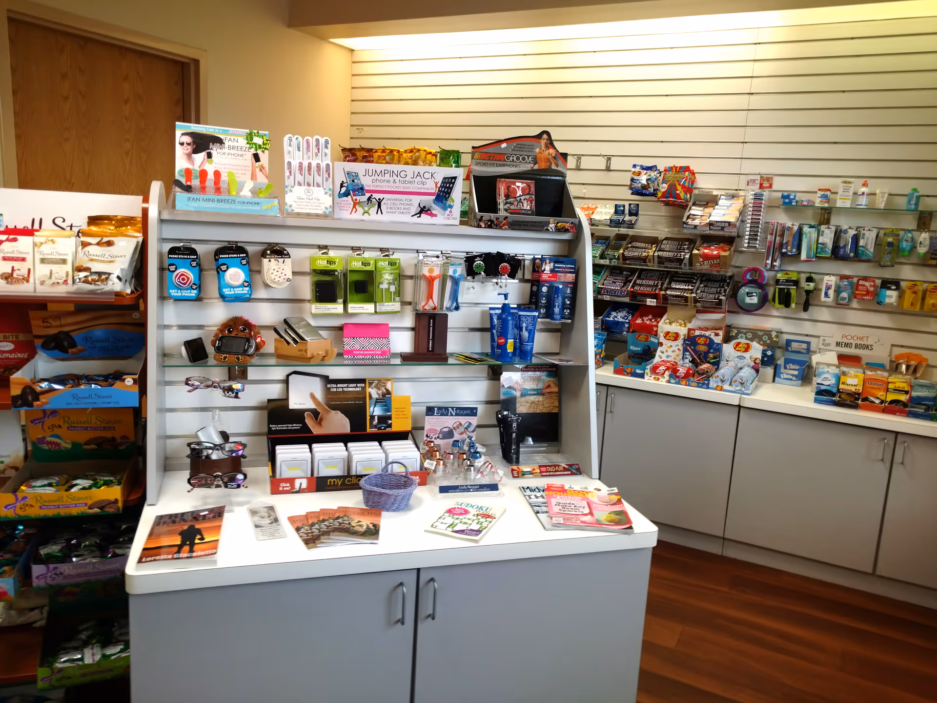Interior shop area with shelves of medical supplies and gifts in a hallway.