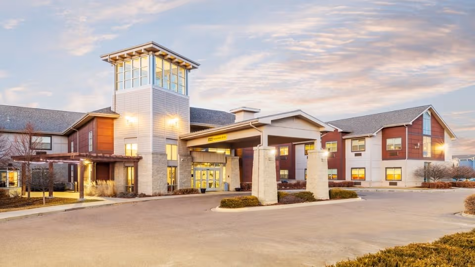 Exterior view of Coal Creek Post Acute and Assisted Living facility entrance and tower.