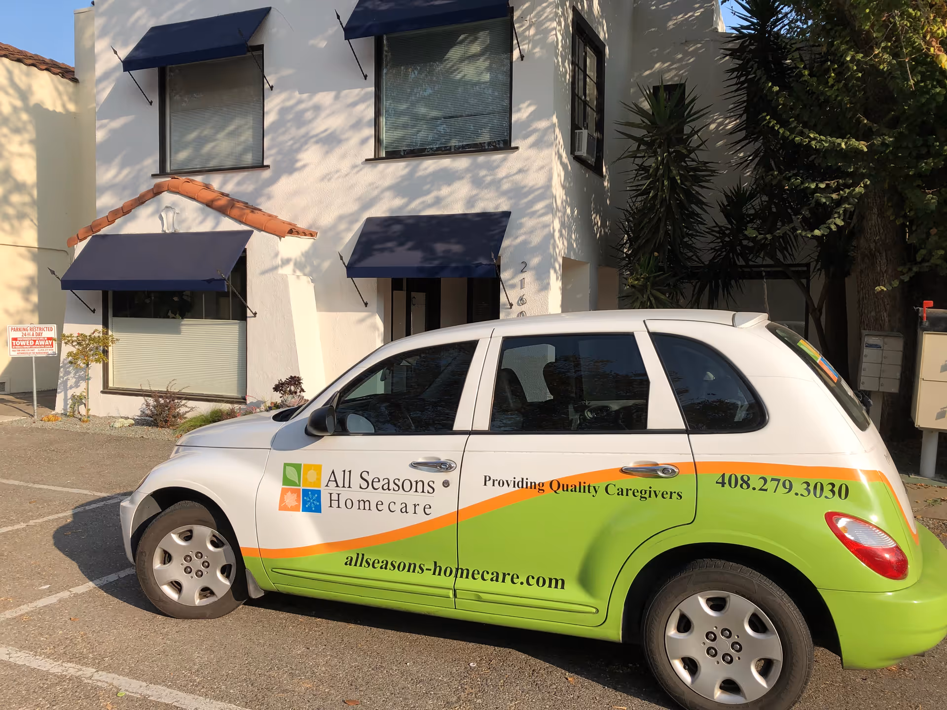 White building with blue awnings and a branded All Seasons Homecare van parked out front.