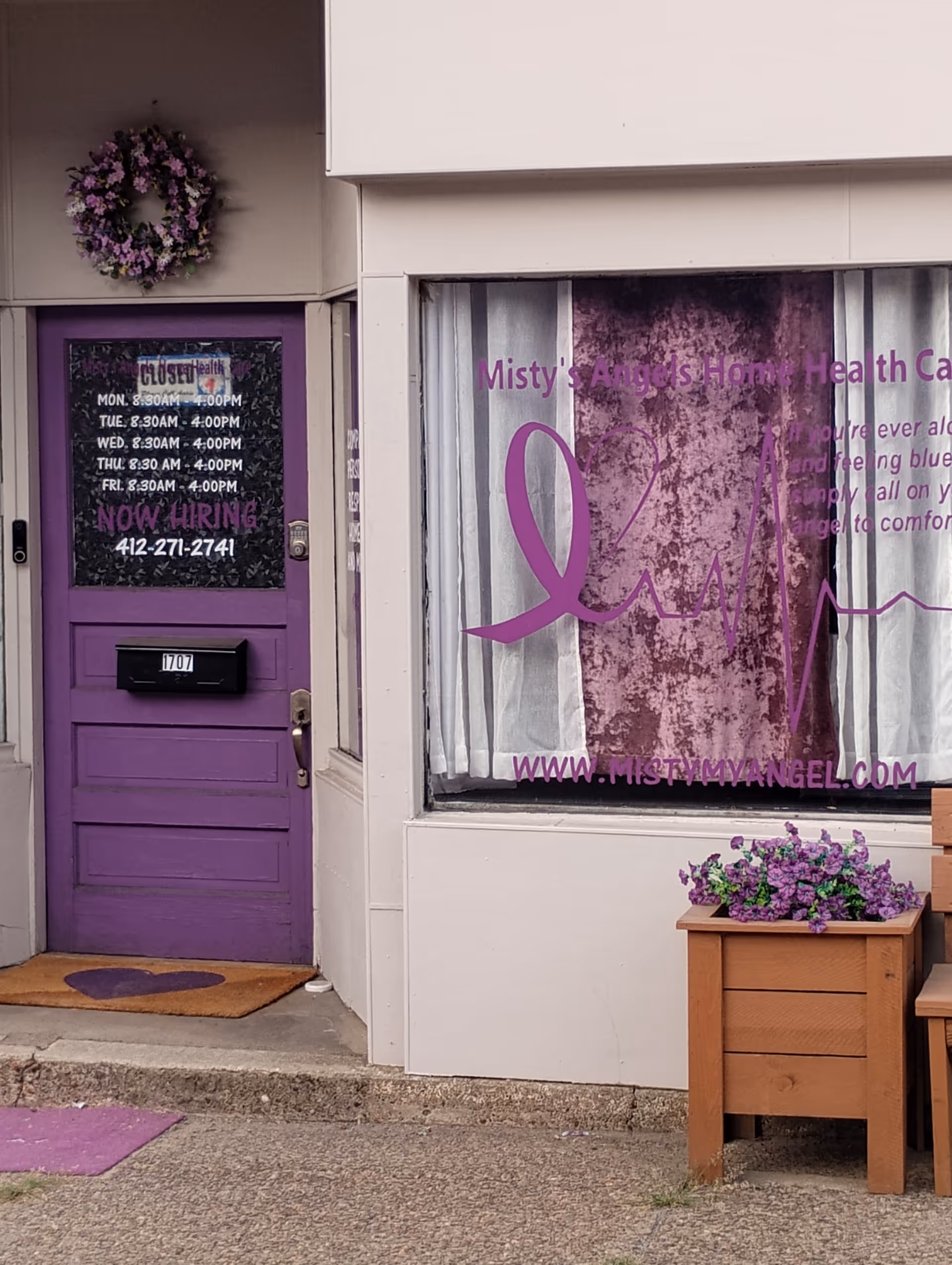 Purple front door and window signage for Misty's Angels Home Health Care storefront.