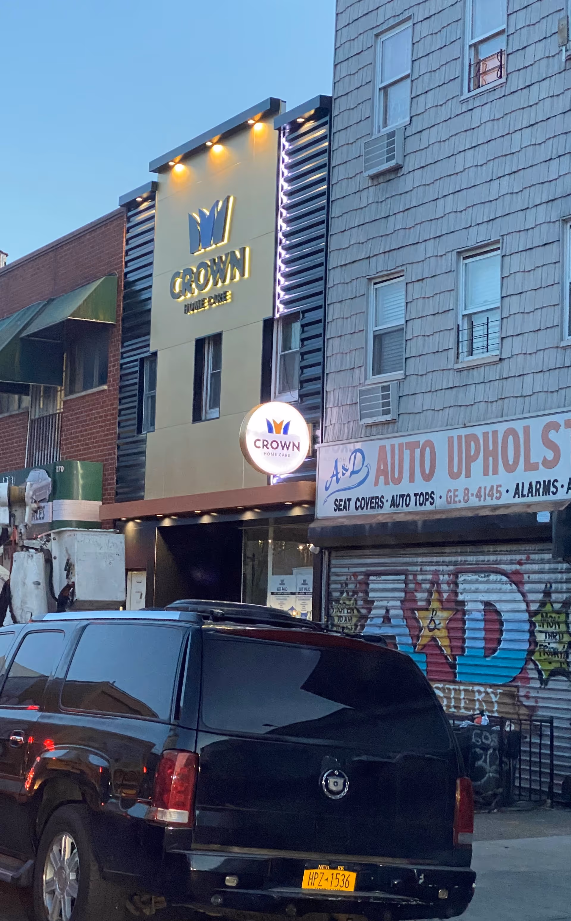Street-level view of Crown Home Care storefront on a busy urban block.