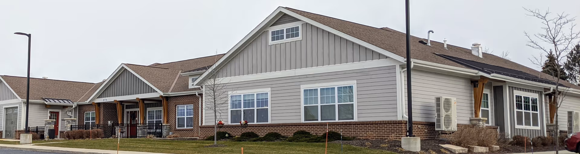 Exterior view of Azura Memory Care of Oak Creek II building with multiple entrances