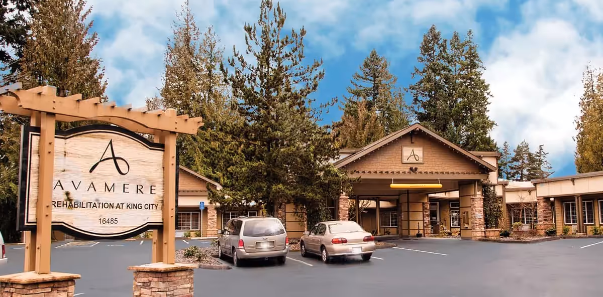 Exterior view of Avamere Rehabilitation of King City with sign, parking, and entrance.