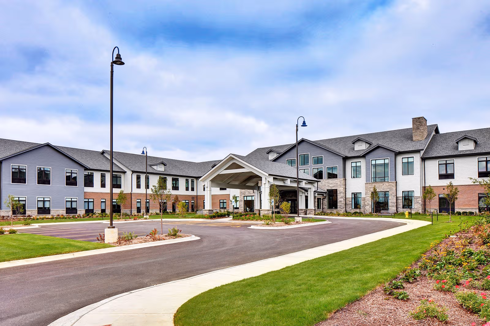 Exterior view of StoryPoint Bolingbrook with entrance canopy and surrounding landscaping.