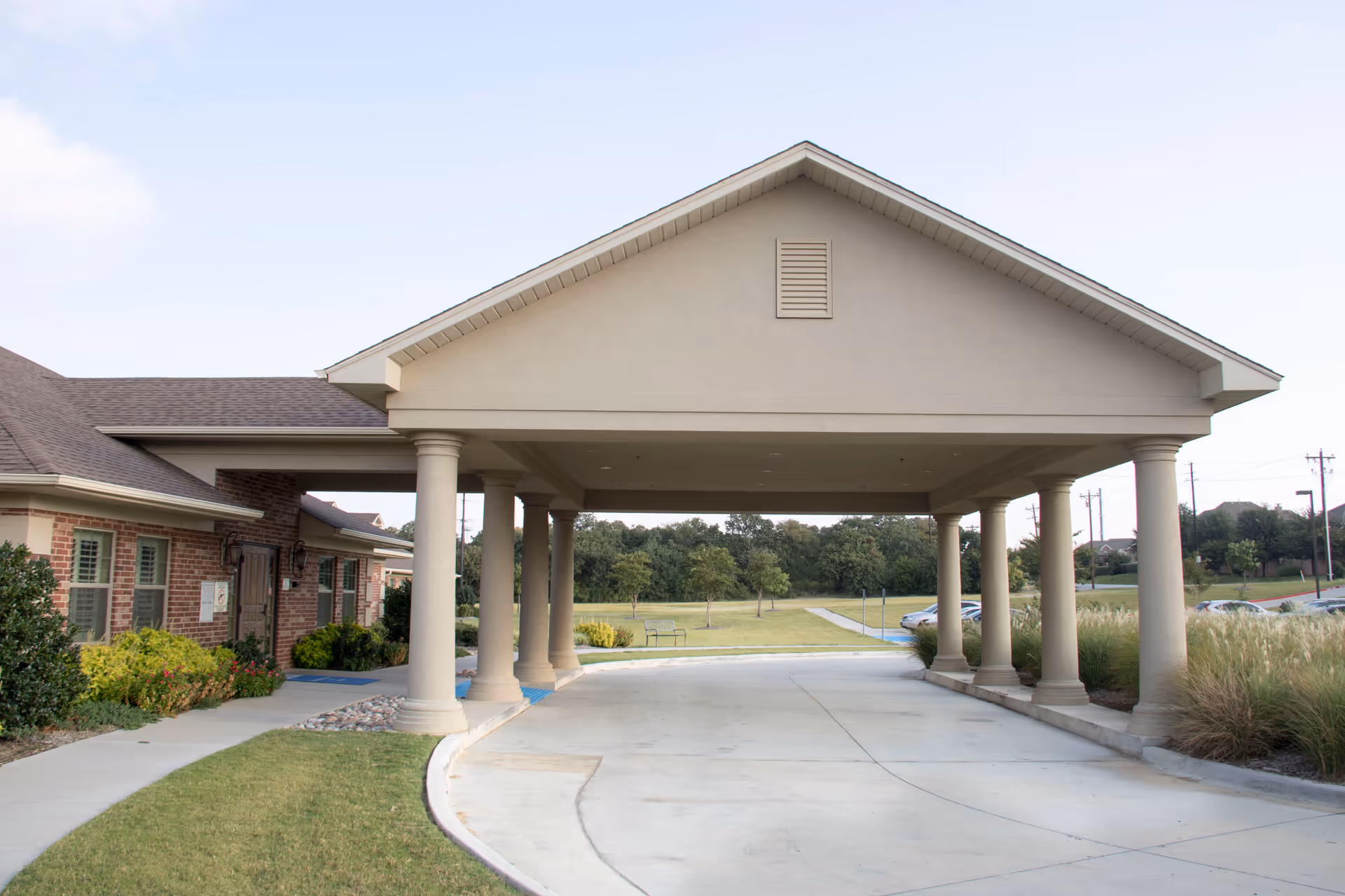 Heritage House entrance features a covered portico with columns.