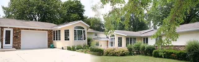 A single-story retirement facility with a beige facade, garage, and landscaped front lawn.
