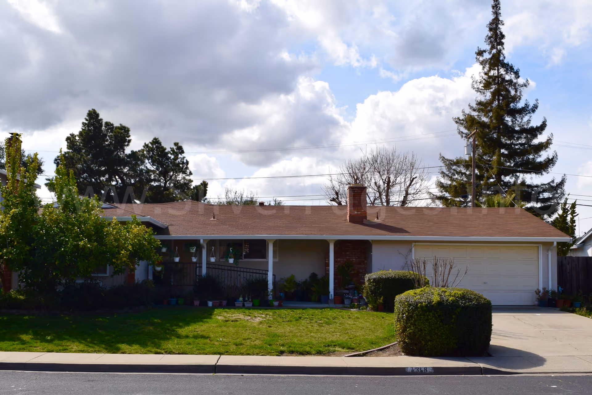 Single-story suburban house with a front yard and attached garage.