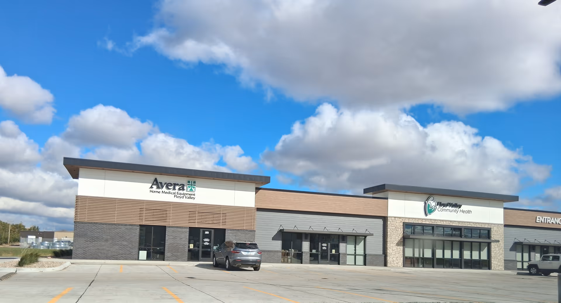 Exterior view of Floyd Valley Community Health building with Avera signage and parking lot.