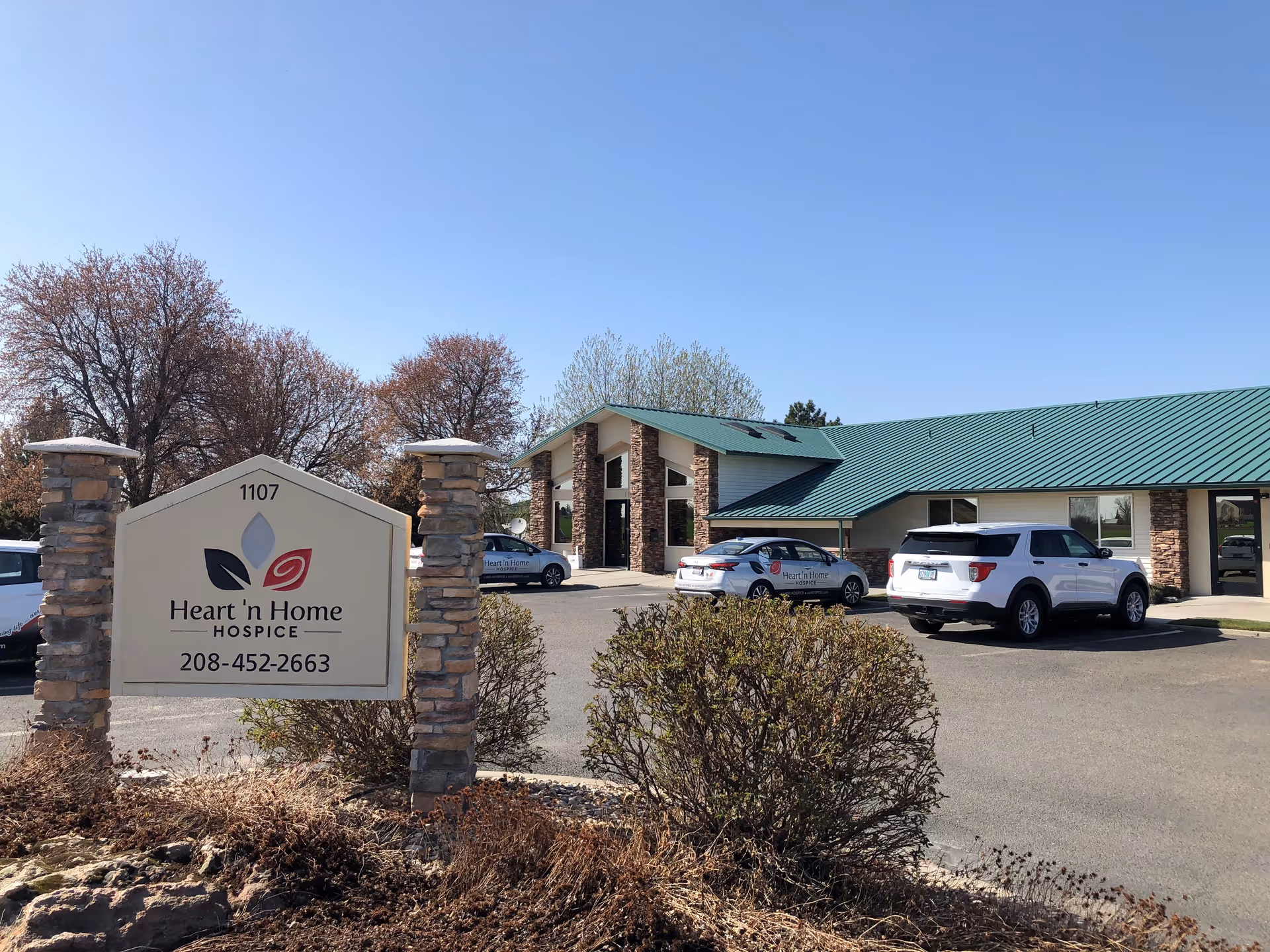 Exterior view of Heart 'n Home Hospice & Palliative Care building with parking lot.
