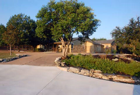Sedro Trail Assisted Living and Memory Care exterior with driveway and trees.