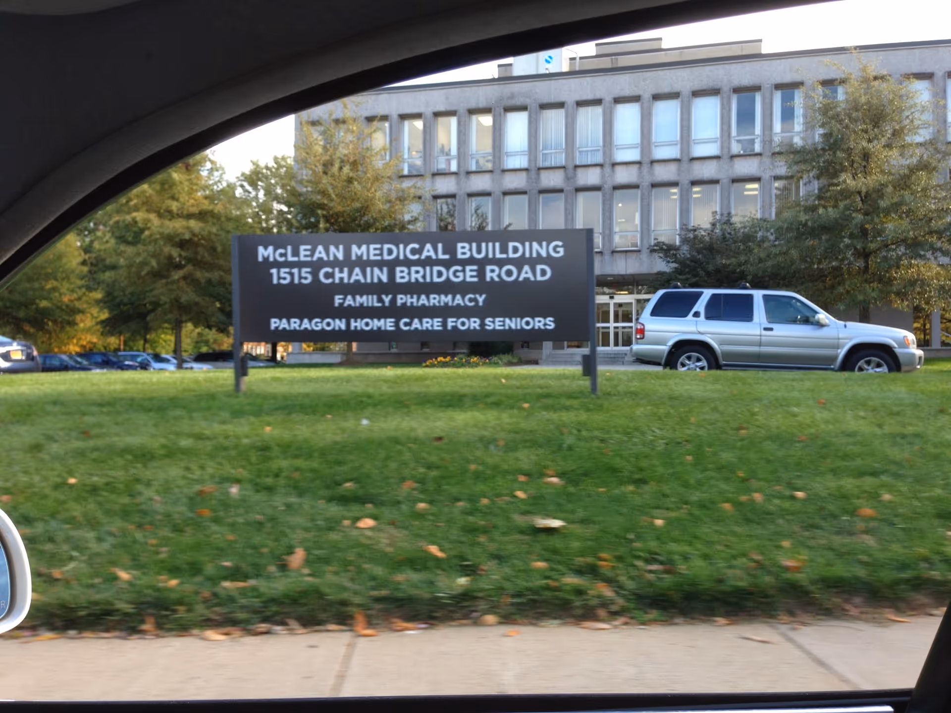 Outdoor sign for Paragon Home Care in front of the McLean Medical Building