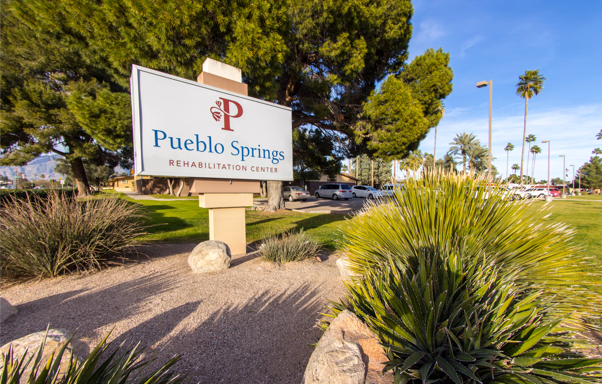 Pueblo Springs Rehabilitation Center sign stands at a landscaped entrance.