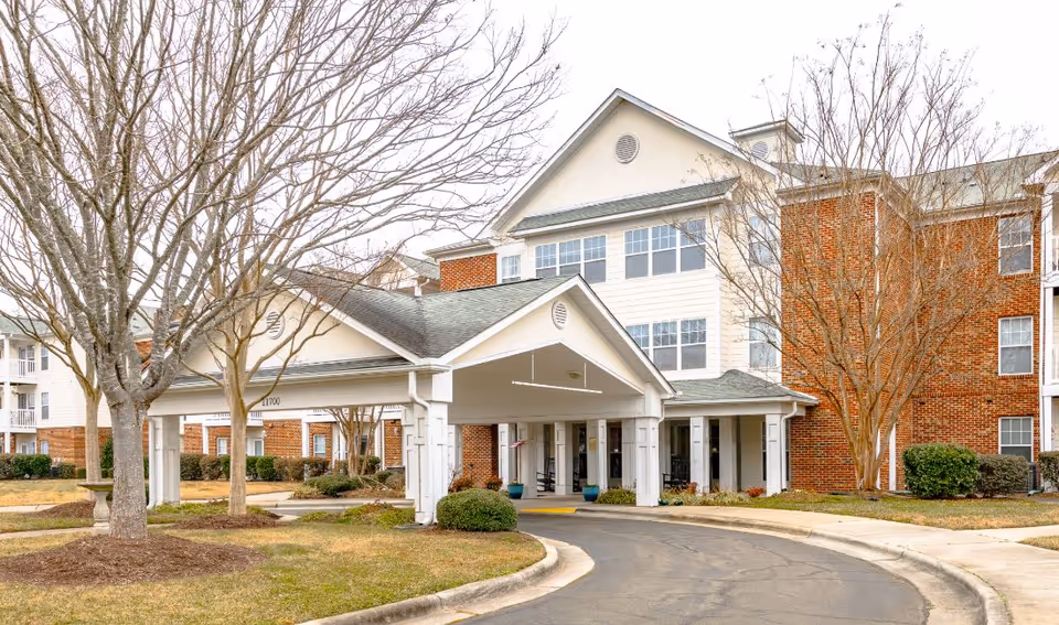 Exterior view of The Meadows at Brier Creek with covered entrance and landscaping.