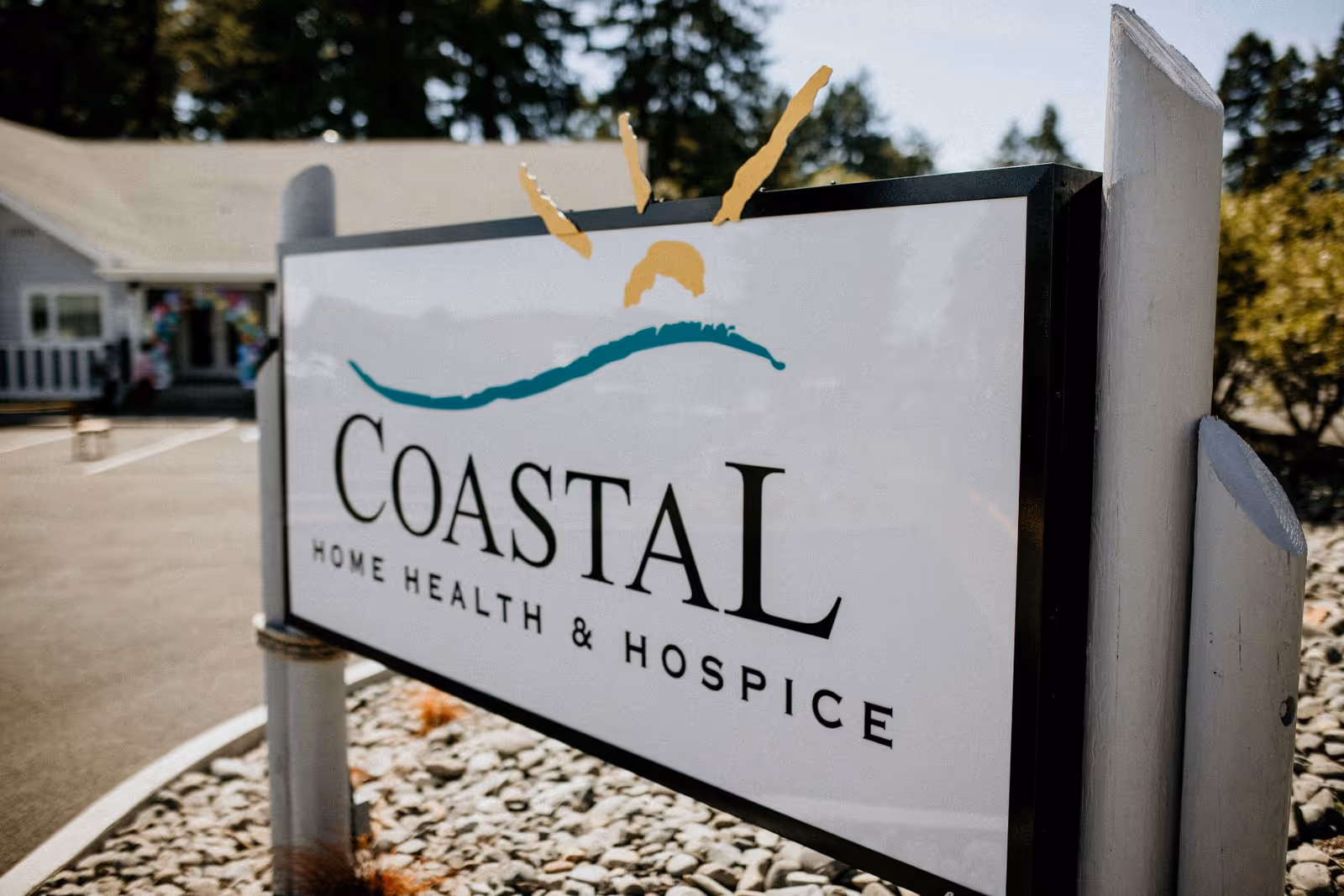 Outdoor sign for Coastal Home Health & Hospice in front of the facility