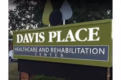 Outdoor sign for Davis Place Healthcare and Rehabilitation Center at the building front.