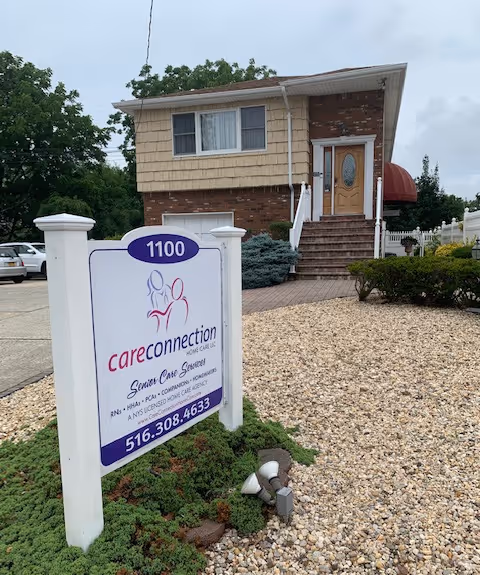 Exterior view of a senior care building with a Care Connection sign at the front.