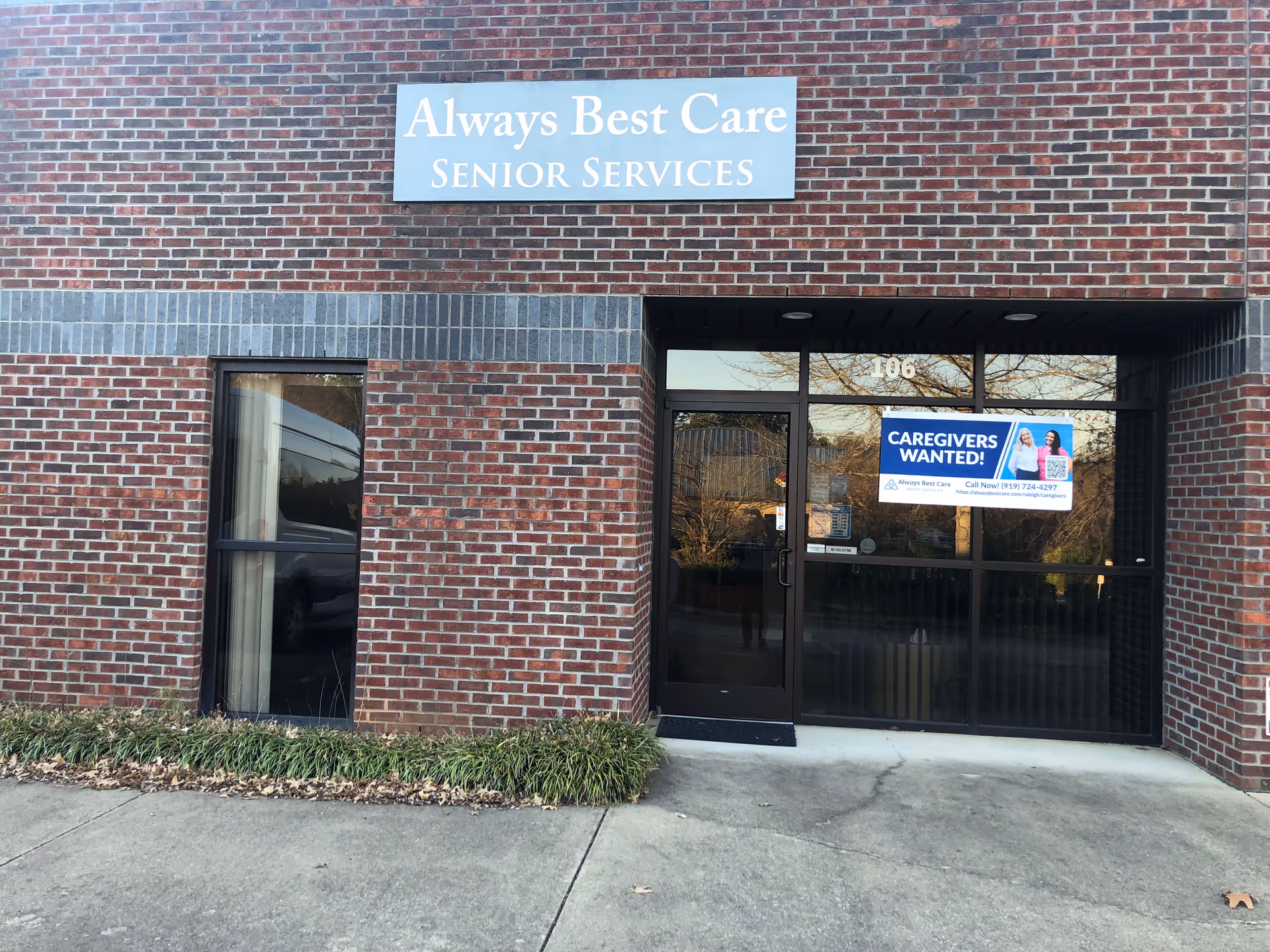 Brick storefront with Always Best Care Senior Services sign and glass entrance.