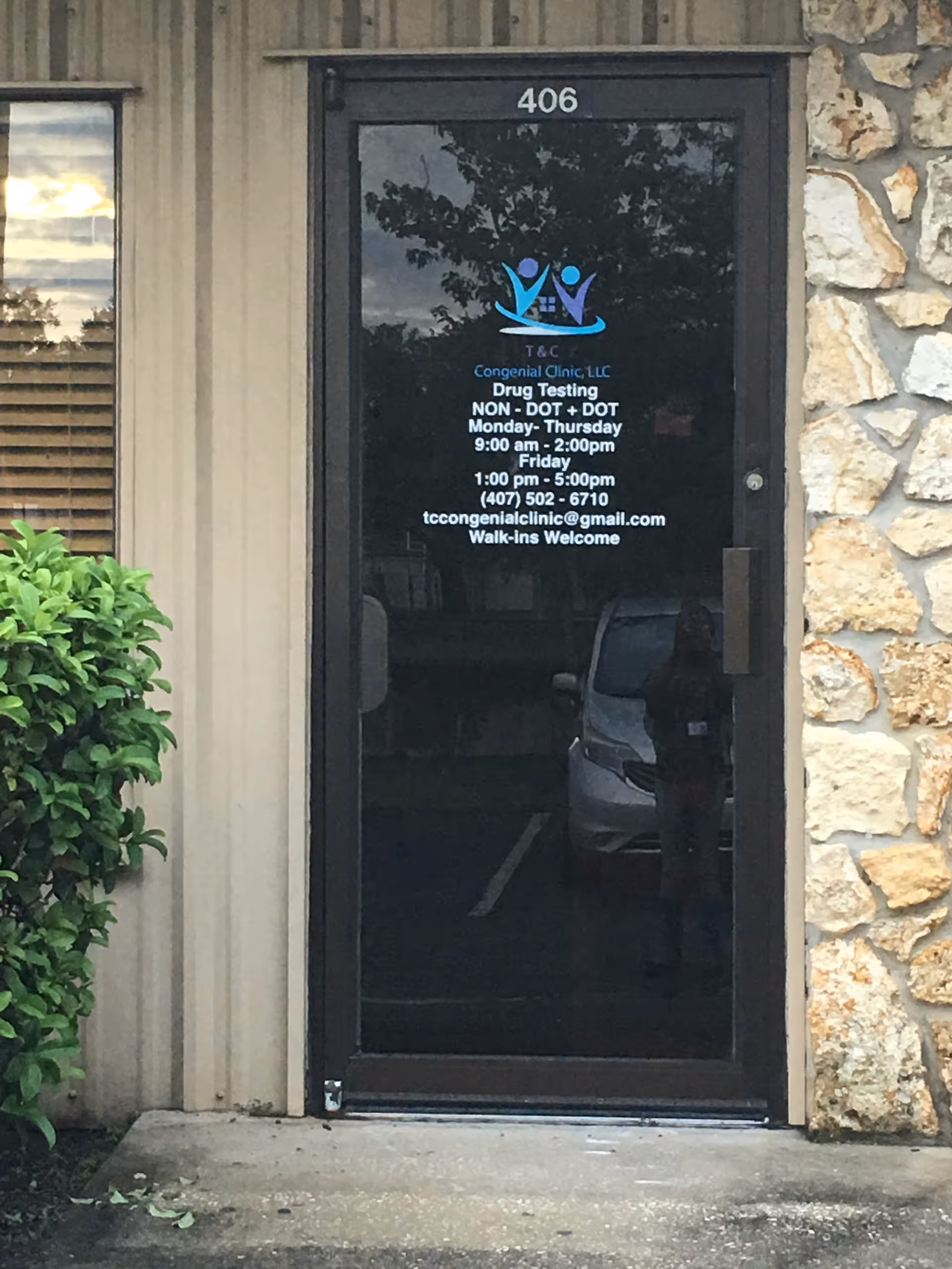 Front entrance of Congenial Home Health Care, LLC; glass door with 406.