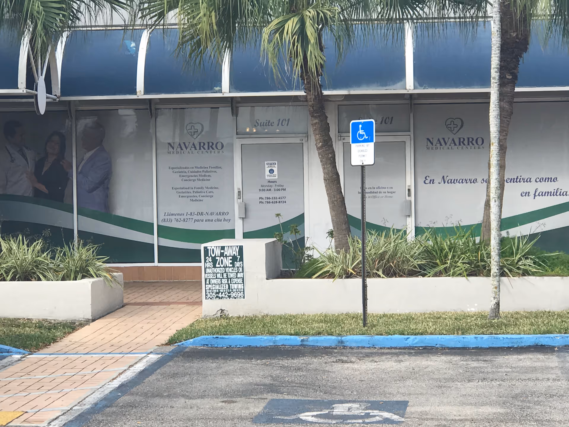 Navarro Medical Centers storefront with signage, palm trees, and a visible handicap parking sign.