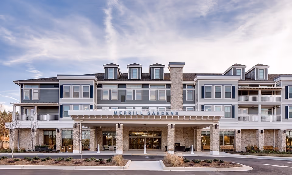 Exterior view of Merrill Gardens at Woodstock, a modern multi-story senior living building.